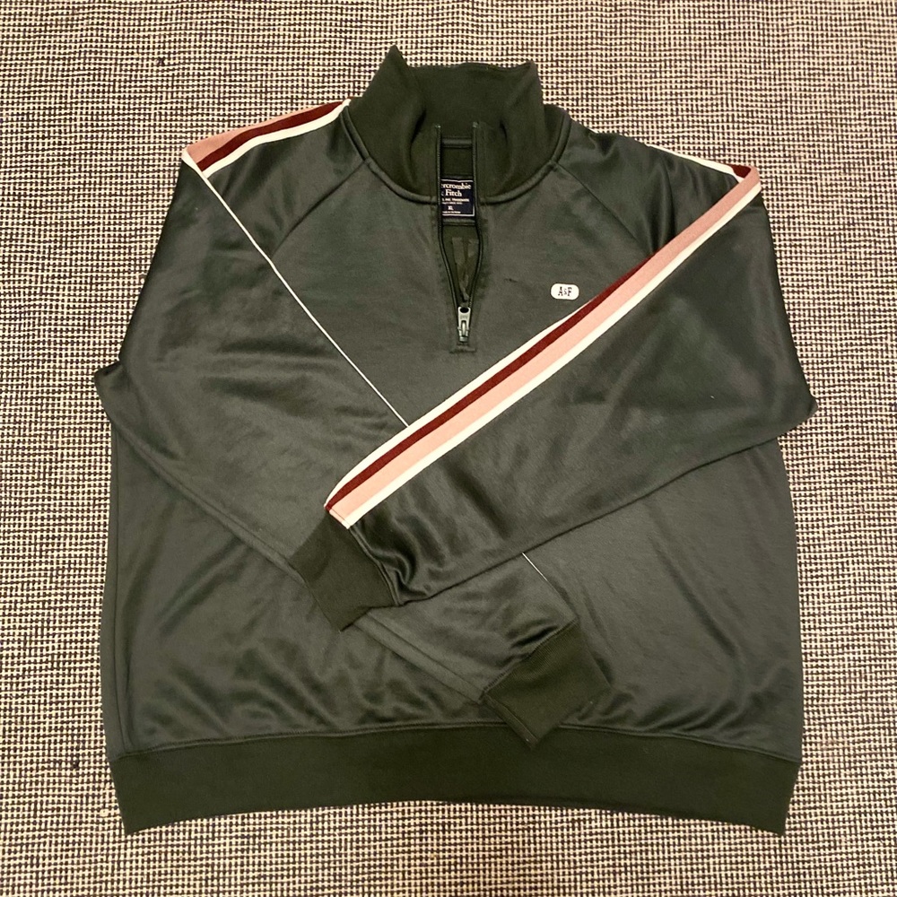 Green quarter zipper jacket good condition slight thread pull by zipper